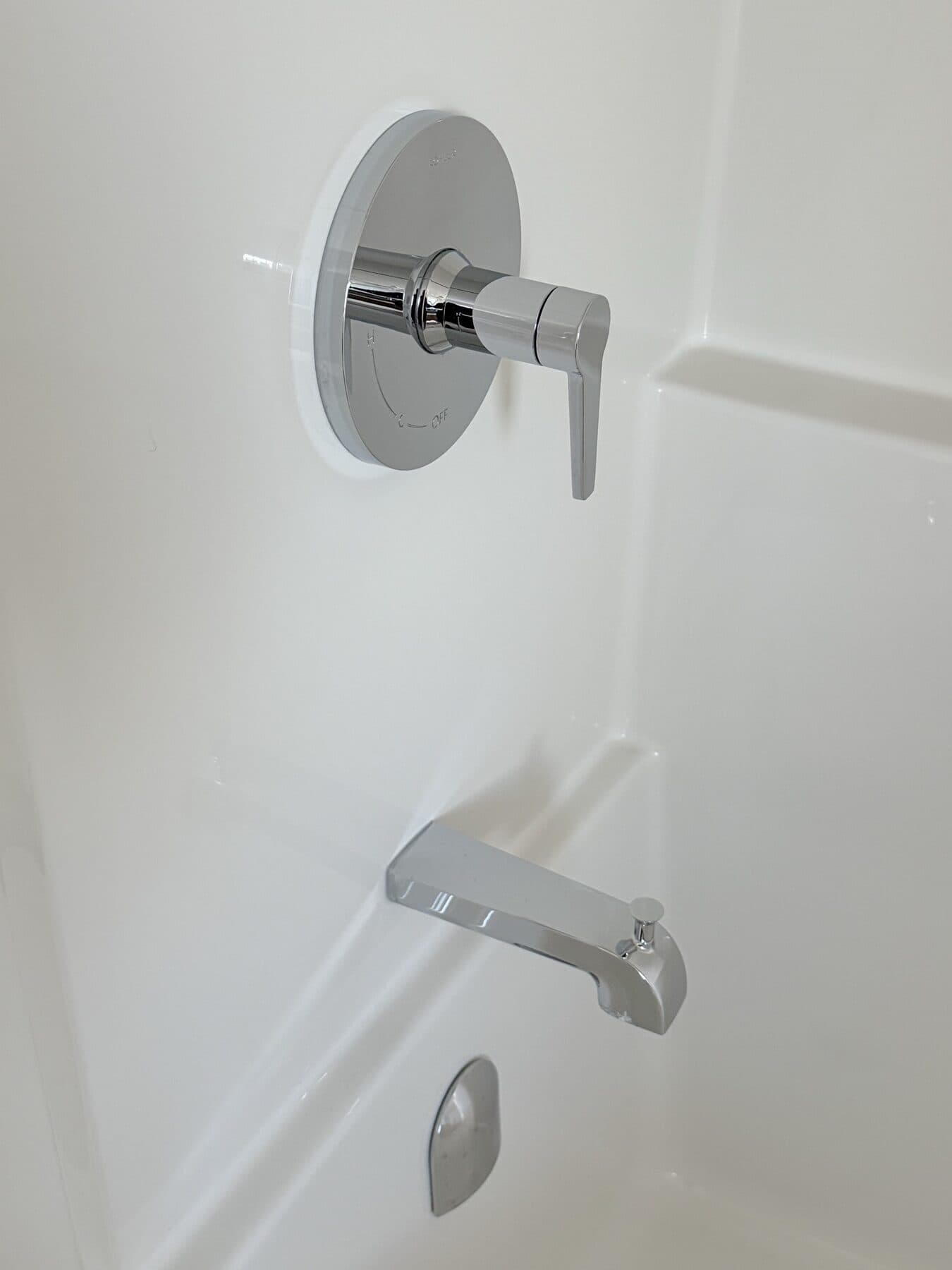Clean bathtub with polished chrome fixtures